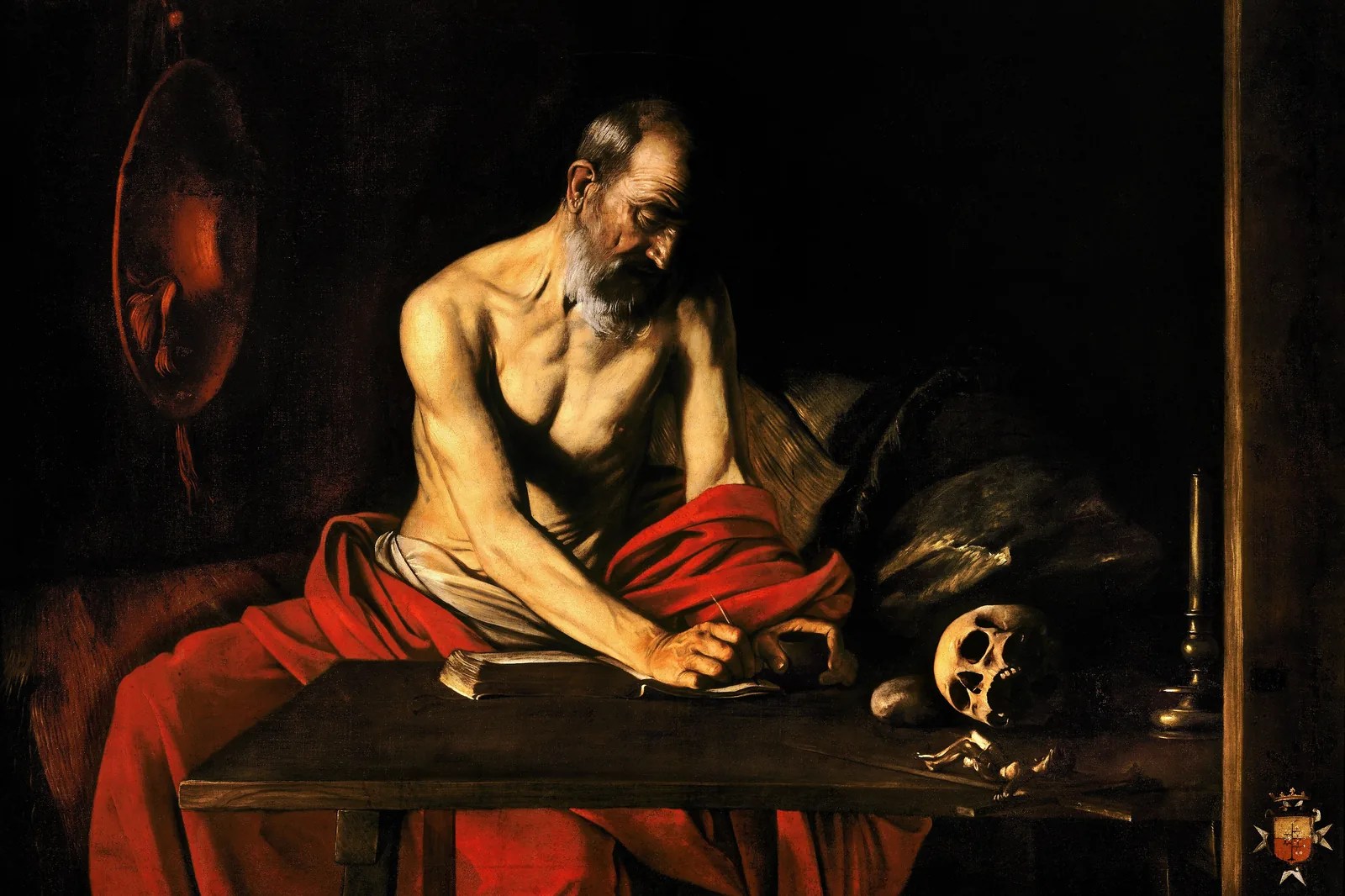 Caravaggio's Saint Jerome Writing: an old man in a red cloth bent over a desk, a skull beside his papers, in a dark room